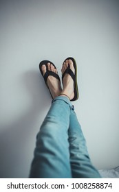 Feet Of A Man In Flip Flops