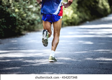 Feet Old Male Athlete Runs A Marathon On Road In Forest