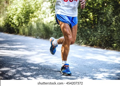 Feet Old Man Runs A Marathon On The Road In Woods