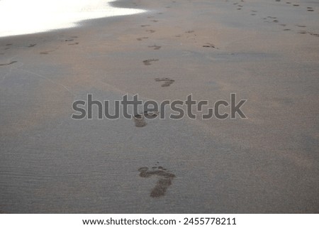 feet on the beach of El Medano
