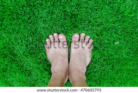 feet on green grass