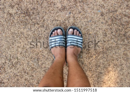 
Feet on the ground and stones and gravel