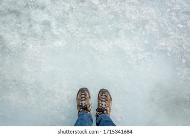 Feet On Ice Background, Walking On Athabasca Glacier In Columbia Icefield, Jasper National Park,  Rocky Mountains, Alberta, Canada 