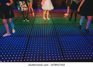 feet on a led dance floor