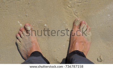 Feet on sand