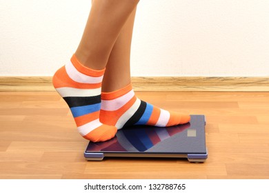 Feet On Scales On Floor In Room