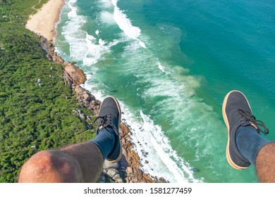 Feet Over The Sea. Paragliding In An Amazing Beach 