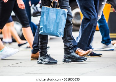 Feet Of Pedestrians Walking On The Crosswalk In Oxford Street, London. Modern Life, Travel And Shopping Concept