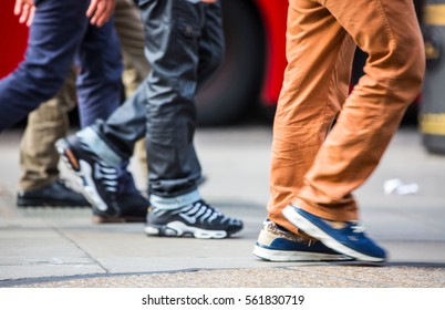 Feet Of Pedestrians Walking On The Crosswalk In Oxford Street, London. Modern Life, Travel And Shopping Concept