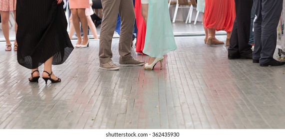 feet of people dancing on a  party. unrecognizable