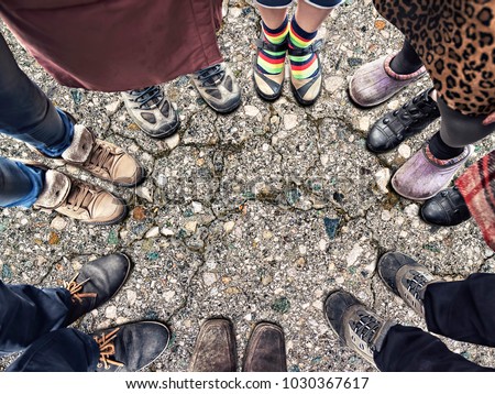feet of people standing in a circle