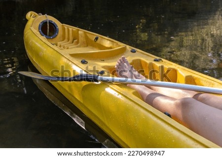 Feet of a person in a kayak.