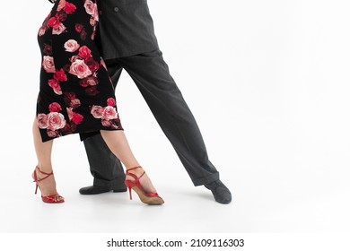 Feet Of Professional Tango Dancers In Dancing Movement On White Background