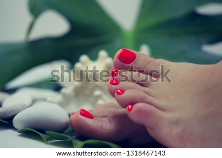 feet with red nails