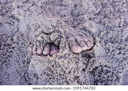 feet with sand