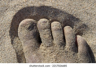 Feet In The Sand On A Beach In Southern California In Summertime.