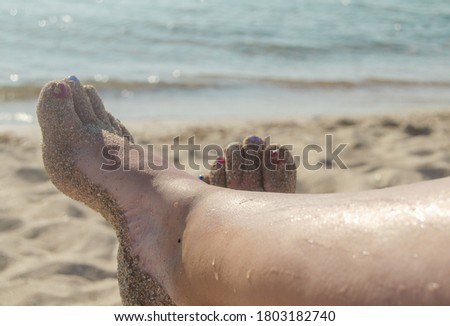 feet in the sand on a summer day,. vacation concept