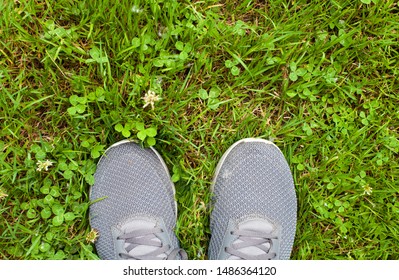 Feet Selfie Of Running Shoes POV Standing On Grass Of Park