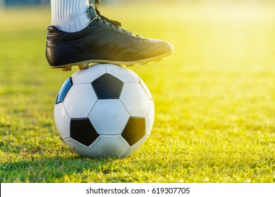 Feet Of Soccer Football Player Standing With The Ball  