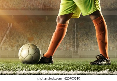 feet of soccer player with a ball