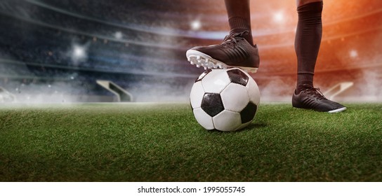 Feet Of Soccer Player Step On Soccer Ball For Kick Off In Stadium