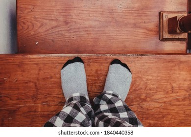 Feet In Socks On The Stairs.