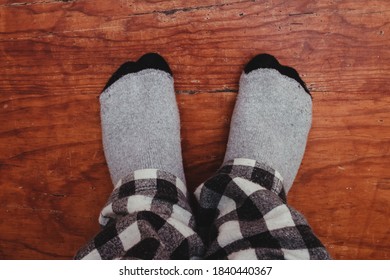 Feet In Socks On The Stairs.