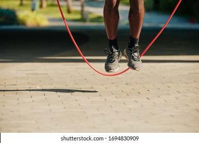 Feet Of Sportsman Jumping With Skipping Rope