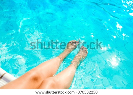 Feet at the swimming pool