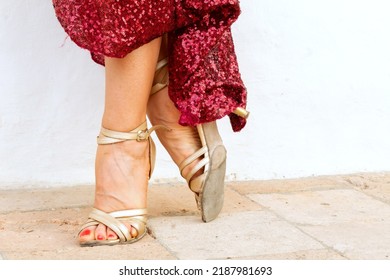 Feet Of Tango Dancer Woman Posing With Red Dress In Home Garden Dancing Outdoors In The City