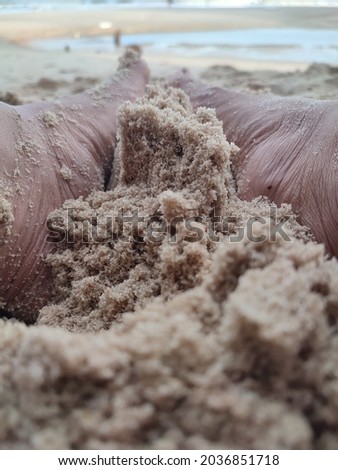 feet that play the beach sand with great fun