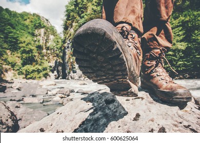 Feet trekking boots hiking Traveler alone outdoor wild nature Lifestyle Travel extreme survival concept summer adventure vacations steps sole view from below