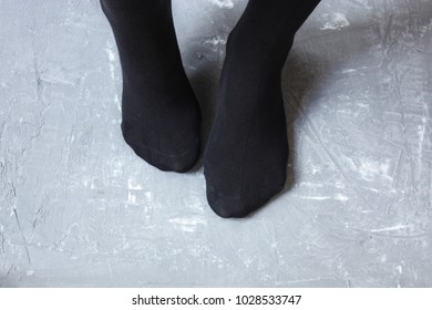 Feet Wearing Black Socks