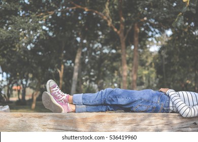 Feet of young girl sleep in the park on nature, Relax time on holiday concept travel , color of hipster tone - Powered by Shutterstock