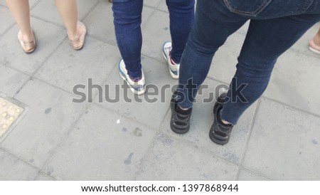 The feets stood on the cement floor