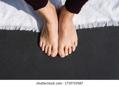 Feets Together On Top Of A Mat