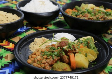Feijoada is a Portuguese food that became popular in Brazil, Angola, Mozambique, Timor-Leste and Macau. It consists of a bean stew, with meat, and almost always accompanied by rice.