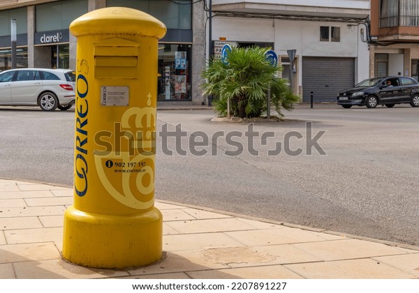 Felanitx, Spain;\
september 21 2022: Yellow mailbox for sending postal letters of the\
Spanish state-owned company, Correos y Telegrafos, located in the\
Majorcan town of Felanitx,\
Spain