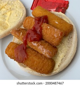 Felixstowe, Suffolk - 1 July 2021: Fish Finger Butty On A White Roll With Tomato Ketchup.