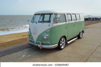 FELIXSTOWE, SUFFOLK, ENGLAND - AUGUST 27, 2016: Classic Green and white  VW Camper Van parked on Seafront Promenade.