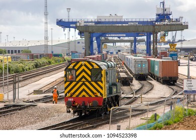 FELIXSTOWE, SUFFOLK, UK - JUNE 30, 2012: Freightliner's Class 08 Shunter No. 08585 'Vicky' runs through the yard at Felixstowe Docks, preparing trains of intermodal stock for movement into the UK.