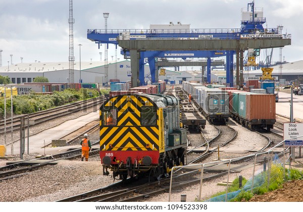 FELIXSTOWE, SUFFOLK, UK - JUNE 30, 2012:\
Freightliner\'s Class 08 Shunter No. 08585 \'Vicky\' runs through the\
yard at Felixstowe Docks, preparing trains of intermodal stock for\
movement into the\
UK.