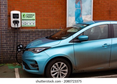 Felixstowe Suffolk UK November 13 2021: A 2021 Model Electric Renault Zoe Charging At Plug In Charge Station In A Public Car Park In Suffolk, UK