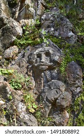 
Felled faces in the stone of the mountain
