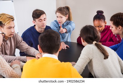 Fellow Students Playing Mafia Game At Recess During School Day