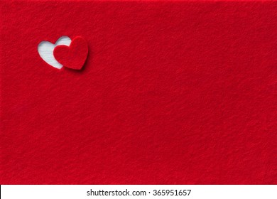 Felt Background for design to Valentine's Day. Decorative heart from red felt. View from above. Valentines Day concept