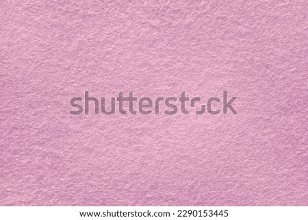 Felt fabric texture background in pink color with copy space for design.