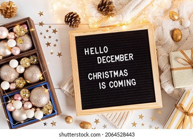 Felt letter board with text hello december, Christmas is coming and xmas decoration. Winter holidays celebration concept. Flat lay, top view - Powered by Shutterstock