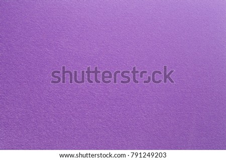 Felt surface in deep dark purple color. Abstract background and texture for design.