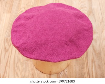 felting workshop - handmade felt beret is drying on wooden hat block - Powered by Shutterstock - Get 15% off with code: PIKWIZARD15